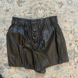 Black leather shorts with fake buttons